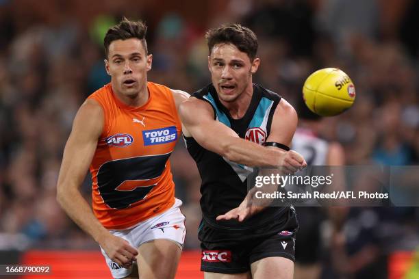 Jed McEntee of the Power and Josh Kelly of the Giants during the 2023 AFL Second Semi Final match between the Port Adelaide Power and the GWS GIANTS...