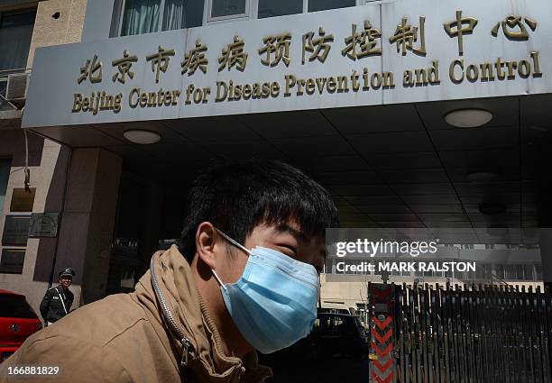 Chinese man leaves the Beijing Center for Disease Prevention and Control as the country deals with the H7N9 bird flu virus on April 18, 2013. China...