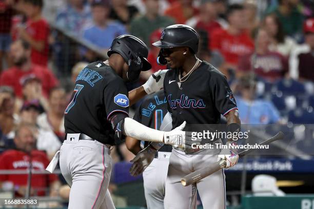 Jesus Sanchez and Jazz Chisholm Jr. #2 of the Miami Marlins react following a two run home run by Sanchez during the sixth inning against the...