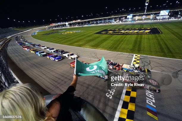 Chase Purdy, driver of the Bama Buggies Chevrolet, leads the field to the green flag to start the NASCAR Craftsman Truck Series Kansas Lottery 200 at...