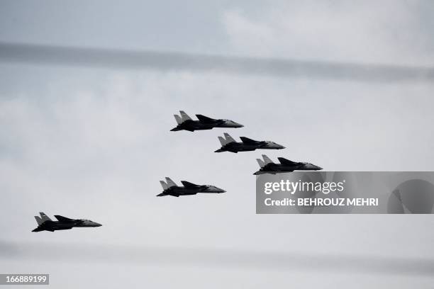 Iranian army's F-14 fighter jets fly during the Army Day parade in Tehran on April 18, 2013. The Iranian army "alone" is able to destroy Israel,...