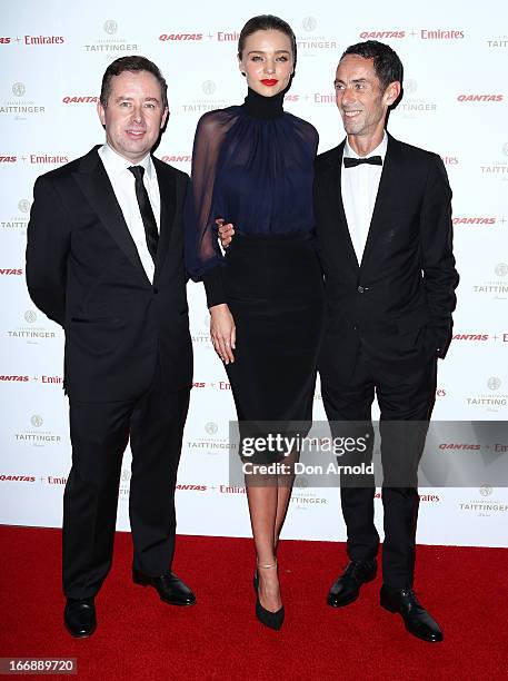 Alan Joyce, Miranda Kerr and Martin Grant attend the QANTAS Gala Dinner at Sydney Domestic Airport on April 18, 2013 in Sydney, Australia.