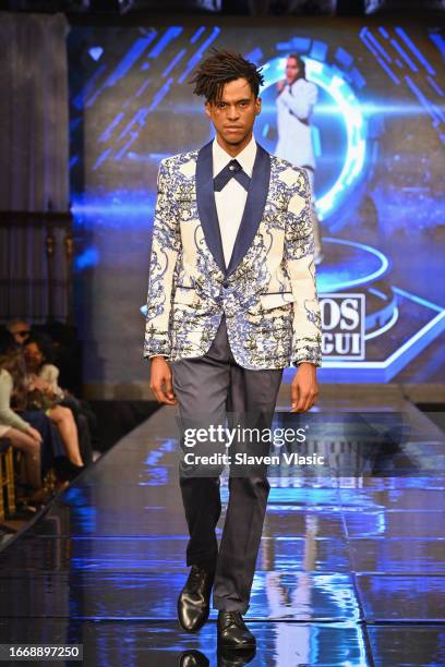 Model walks the runway wearing designer Carlos Benguigui, during the NYFW hiTechMODA Season 10 Production at Gotham Hall on September 08 in New York...