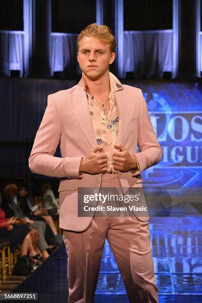 Model walks the runway wearing designer Carlos Benguigui, during the NYFW hiTechMODA Season 10 Production at Gotham Hall on September 08 in New York...