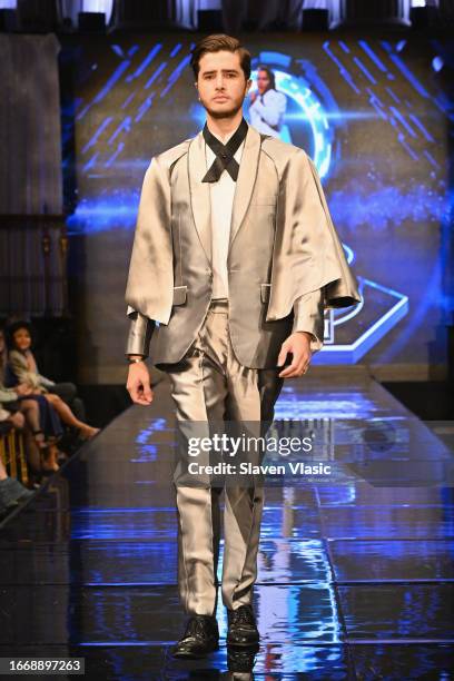 Model walks the runway wearing designer Carlos Benguigui, during the NYFW hiTechMODA Season 10 Production at Gotham Hall on September 08 in New York...