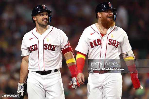 Adam Duvall of the Boston Red Sox and Justin Turner laugh during the sixth inning against the Baltimore Orioles at Fenway Park on September 08, 2023...