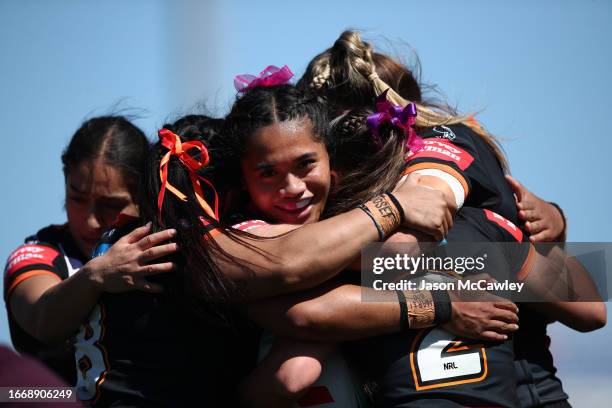 Leianne Tufuga of the Wests Tigers celebrates a try scored by Jakiya Whitfeld of the Wests Tigers during the round eight NRLW match between Wests...