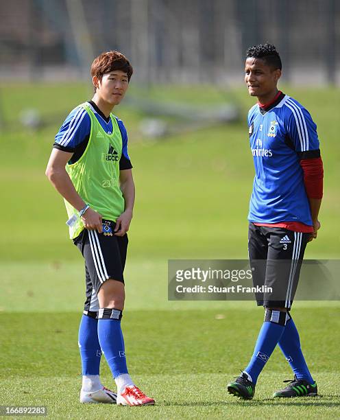Heung Min Son of Hamburg talks with Michael Mancienne during a training session of Hamburger SV on April 18, 2013 in Hamburg, Germany.