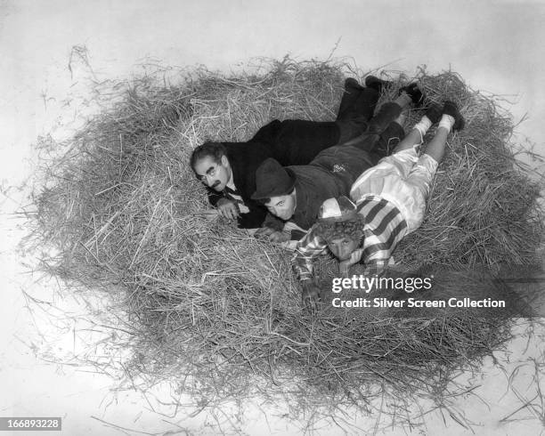 American comedians The Marx Brothers in a publicity still for 'A Day at the Races', directed by Sam Wood, 1937. Left to right: Groucho Marx , Chico...