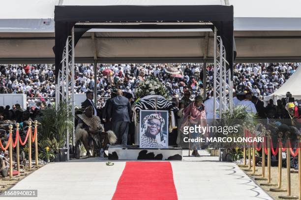 An elderly woman moves away from the coffin of the Zulu prince Mangosuthu Buthelezi during his funeral proceedings in Ulundi, on September 16, 2023.