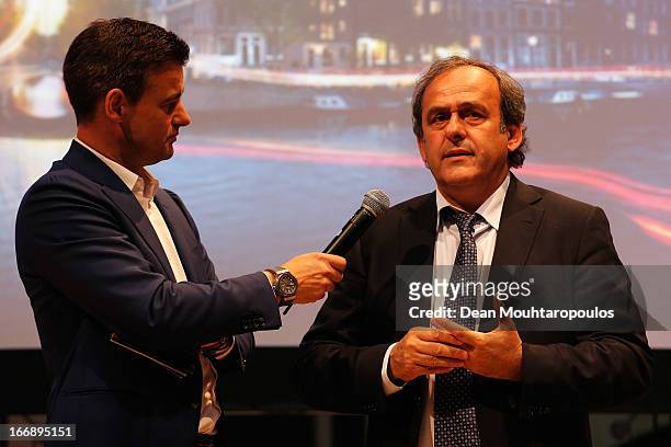Master of Ceremony, Wilfred Genee and Michel Platini, President of the Union of European Football Associations speak to the media and guests during...