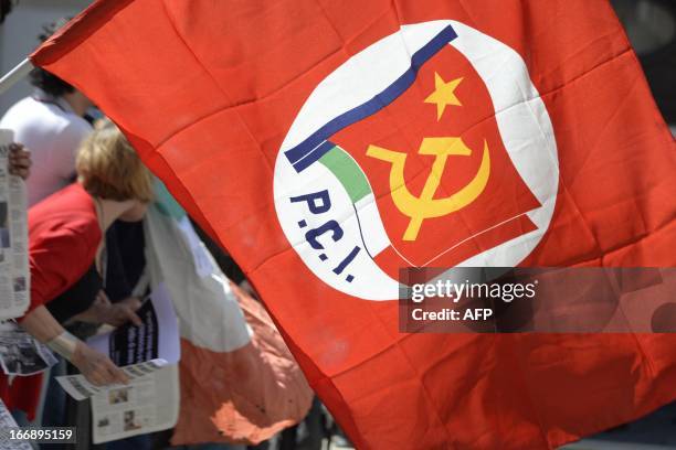 Protester holds an Italian communist party flag during a demonstartion in front of the parliament during a session for the election of the President...