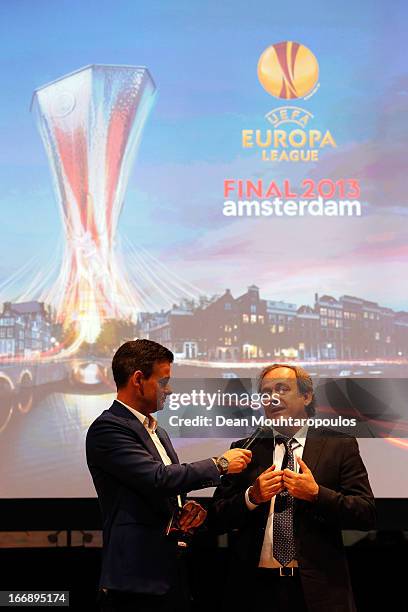 Master of Ceremony, Wilfred Genee and Michel Platini, President of the Union of European Football Associations speak to the media and guests during...