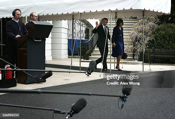 President Barack Obama and first lady Michelle Obama come out from the White House prior to their departure for Boston, on April 18, 2013 in...