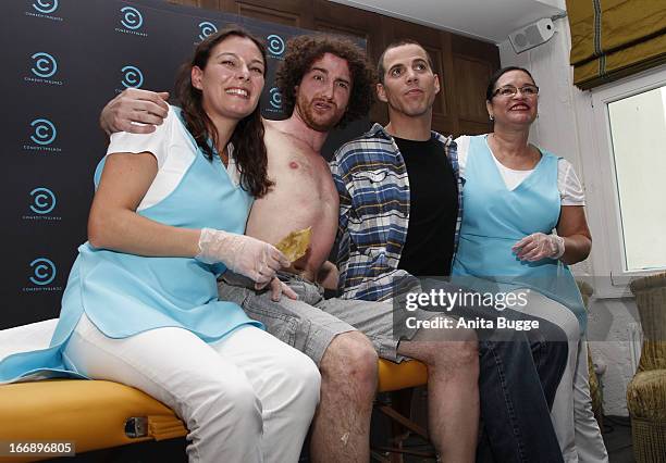 Comedian Stephen Glover, aka Steve-O , poses with beauticians Gisele Binkowski and Rosangela Peres after perfroming a hotwaxing stunt on Filippo...