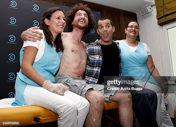 Comedian Stephen Glover, aka Steve-O , poses with beauticians Gisele Binkowski and Rosangela Peres after perfroming a hotwaxing stunt on Filippo...