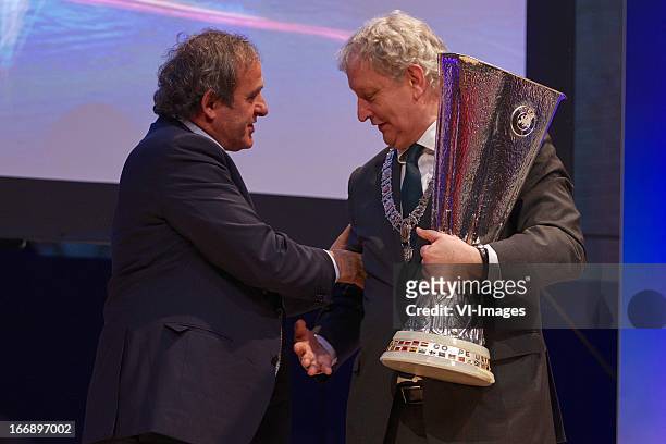 Michel Platini, burgermeester Eberhard van der Laan during the UEFA Europa League trophy handover ceremony on April 18, 2013 at Amsterdam, The...