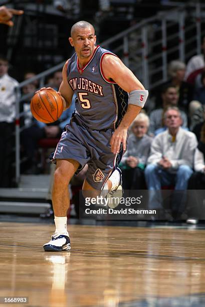 Jason Kidd of the New Jersey Nets dribbles the ball during the game against the Minnesota Timberwolves at Target Center on November 23, 2002 in...