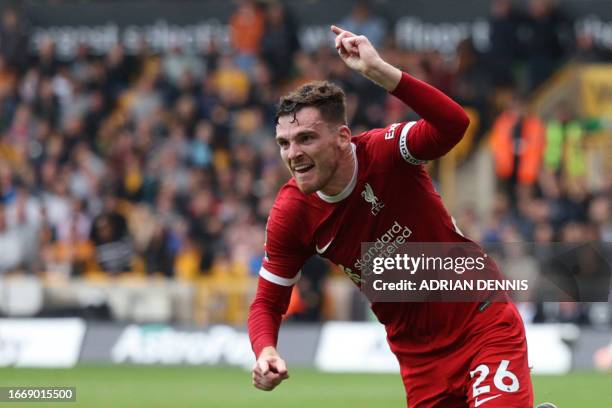 Liverpool's Scottish defender Andrew Robertson celebrates after scoring their second goal during the English Premier League football match between...