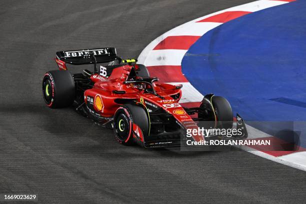 Ferrari's Spanish driver Carlos Sainz Jr drives during the qualifying session of the Singapore Formula One Grand Prix night race at the Marina Bay...