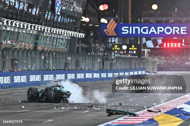 Aston Martin's Canadian driver Lance Stroll crashes during the qualifying session of the Singapore Formula One Grand Prix night race at the Marina...