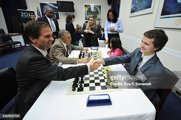 International Master Kayden Troff shares chess tips with Rep. Chris Stewart during a special event held at United States Capitol Building on April...