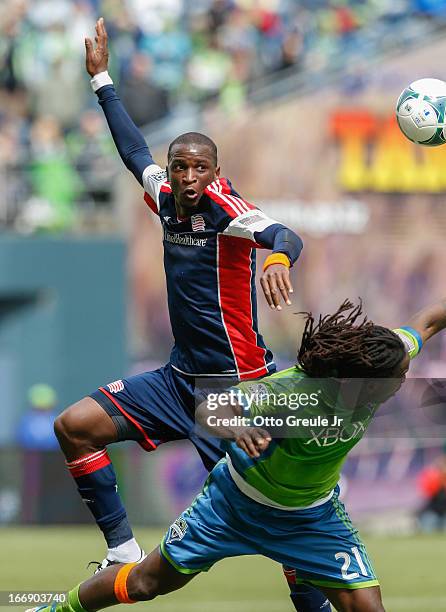 Kalifa Cisse of the New England Revolution battles Shalrie Joseph of the Seattle Sounders FC at CenturyLink Field on April 13, 2013 in Seattle,...