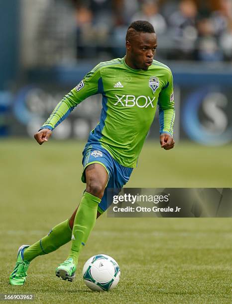 Steve Zakuani of the Seattle Sounders FC dribbles against the New England Revolution at CenturyLink Field on April 13, 2013 in Seattle, Washington.