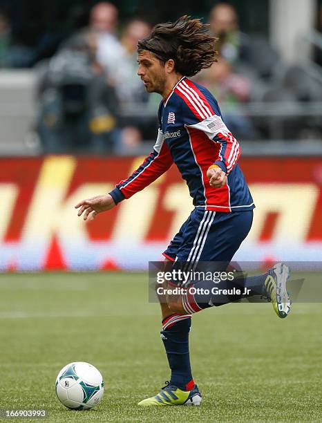 Juan Toja of the New England Revolution dribbles against the Seattle Sounders FC at CenturyLink Field on April 13, 2013 in Seattle, Washington.