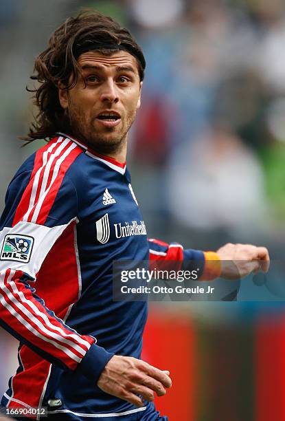 Juan Toja of the New England Revolution follows the play against the Seattle Sounders FC at CenturyLink Field on April 13, 2013 in Seattle,...