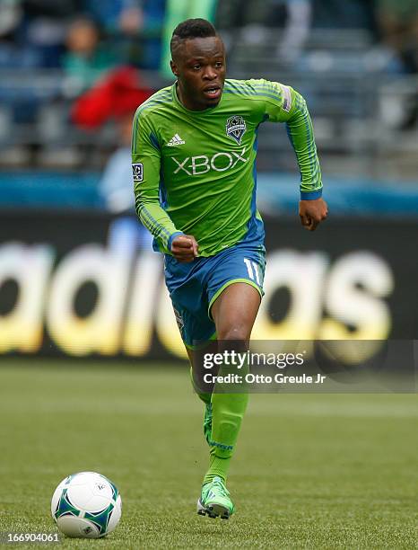 Steve Zakuani of the Seattle Sounders FC dribbles against the New England Revolution at CenturyLink Field on April 13, 2013 in Seattle, Washington.