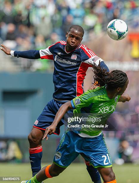 Kalifa Cisse of the New England Revolution battles Shalrie Joseph of the Seattle Sounders FC at CenturyLink Field on April 13, 2013 in Seattle,...