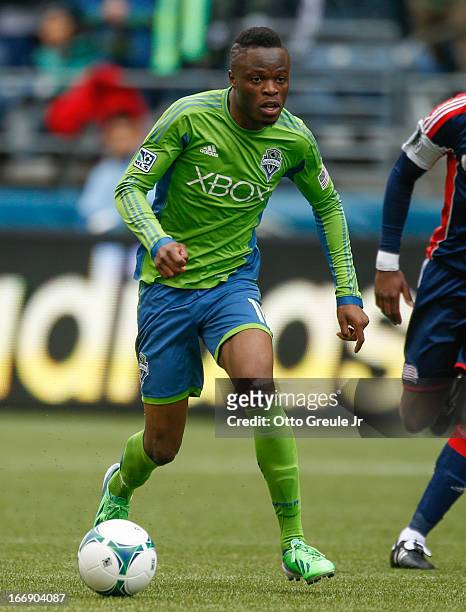 Steve Zakuani of the Seattle Sounders FC dribbles against the New England Revolution at CenturyLink Field on April 13, 2013 in Seattle, Washington.