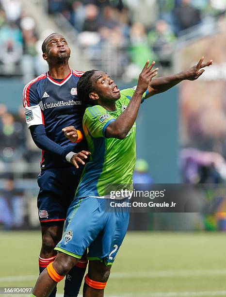 Kalifa Cisse of the New England Revolution battles Shalrie Joseph of the Seattle Sounders FC at CenturyLink Field on April 13, 2013 in Seattle,...