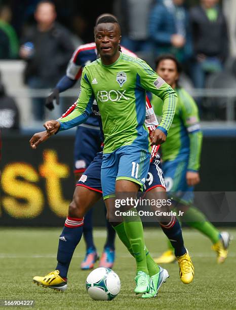 Steve Zakuani of the Seattle Sounders FC dribbles against the New England Revolution at CenturyLink Field on April 13, 2013 in Seattle, Washington.