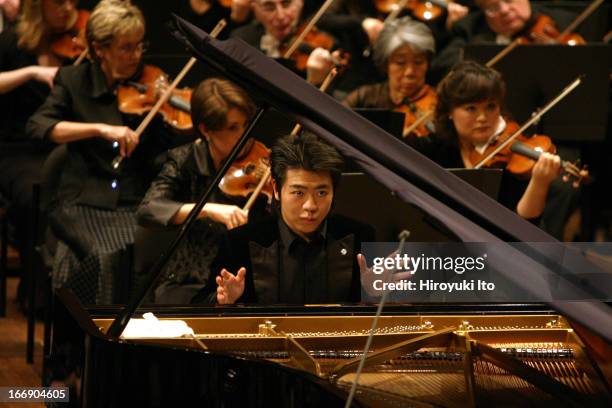 New York Philharmonic performing at Avery Fisher Hall on Thursday night, September 22, 2005.This image: Lang Lang plays piano in Chopin's "Piano...