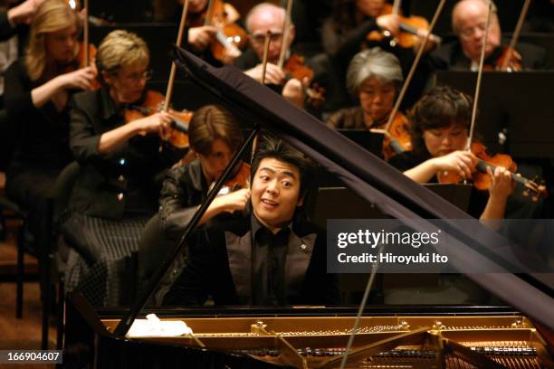 New York Philharmonic performing at Avery Fisher Hall on Thursday night, September 22, 2005.This image: Lang Lang plays piano in Chopin's "Piano...