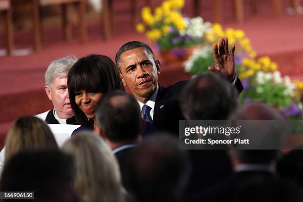 President Barack Obama and first lady Michelle Obama exit after attending an interfaith prayer service for victims of the Boston Marathon attack...