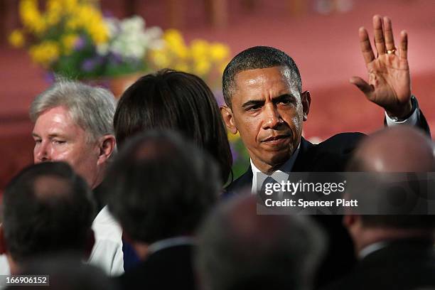 President Barack Obama exits after attending an interfaith prayer service for victims of the Boston Marathon attack titled "Healing Our City," at the...