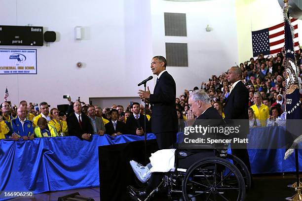 President Barack Obama speaks on stage at Cathedral High School with Boston Mayor Thomas Menino and Massachusetts Gov. Deval Patrick after attending...