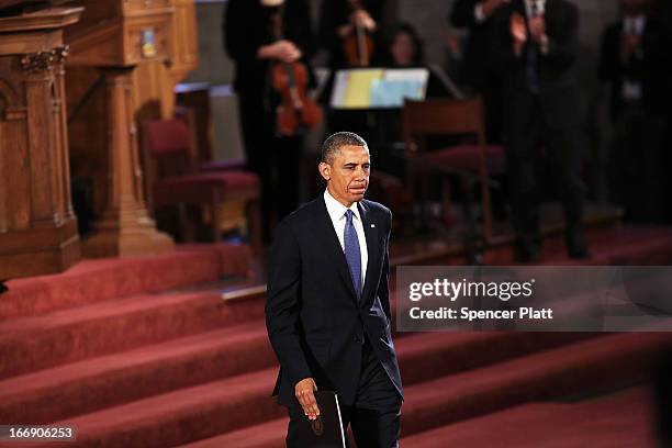 President Barack Obama exits after speaking at an interfaith prayer service for victims of the Boston Marathon attack titled "Healing Our City," at...