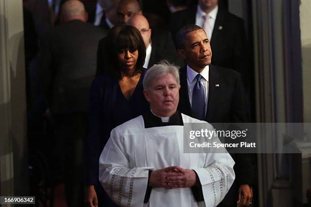 President Barack Obama and first lady Michelle Obama enter an interfaith prayer service for victims of the Boston Marathon attack titled "Healing Our...