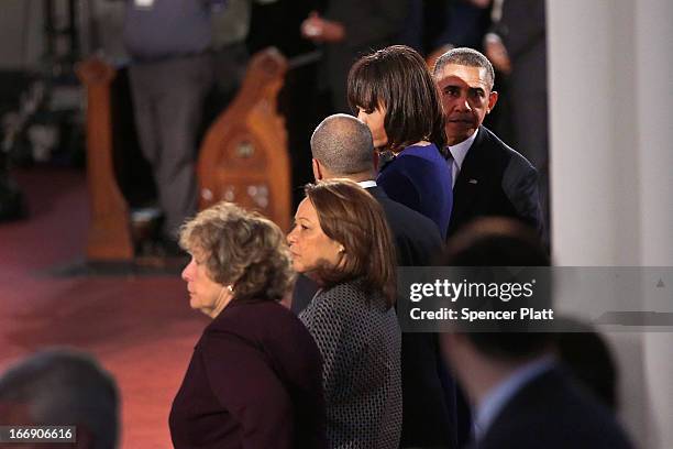 President Barack Obama and first lady Michelle Obama enter an interfaith prayer service for victims of the Boston Marathon attack titled "Healing Our...