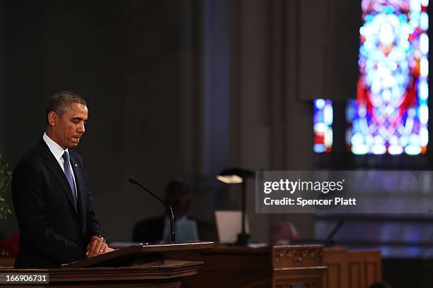 President Barack Obama pauses while speaking at an interfaith prayer service for victims of the Boston Marathon attack titled "Healing Our City," at...