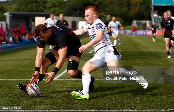 Callum Hunter-Hill of Saracens in action with Caolan Englefield of Gloucester in the Premiership Rugby Cup match between Saracens and Gloucester...
