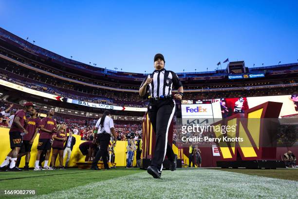 Line judge Maia Chaka walks out onto the field prior to a game between the Baltimore Ravens and the Washington Commanders at FedEx Field on Monday,...