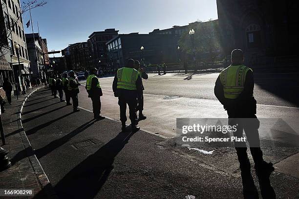 Boston police wait for President Barack Obama's motorcade before he speaks at an interfaith prayer service for victims of the Boston Marathon attack...