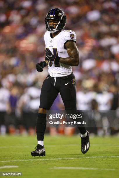 Tarik Black of the Baltimore Ravens runs across the field against the Washington Commanders during the first half at FedEx Field on Monday, August 21...