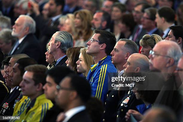 Runners attend an interfaith prayer service for victims of the Boston Marathon attack titled "Healing Our City," and attended by President Barack...