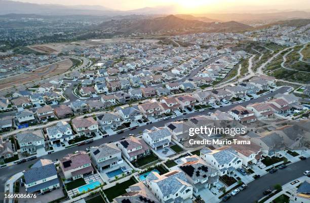 An aerial view of homes in a housing development on September 08, 2023 in Santa Clarita, California. According to the National Association of...